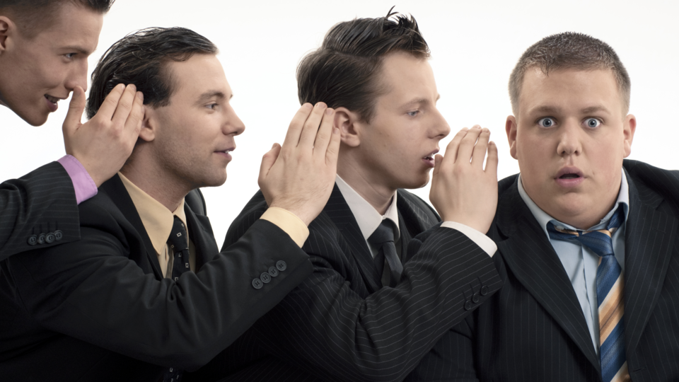 4 men whispering each other into their ears